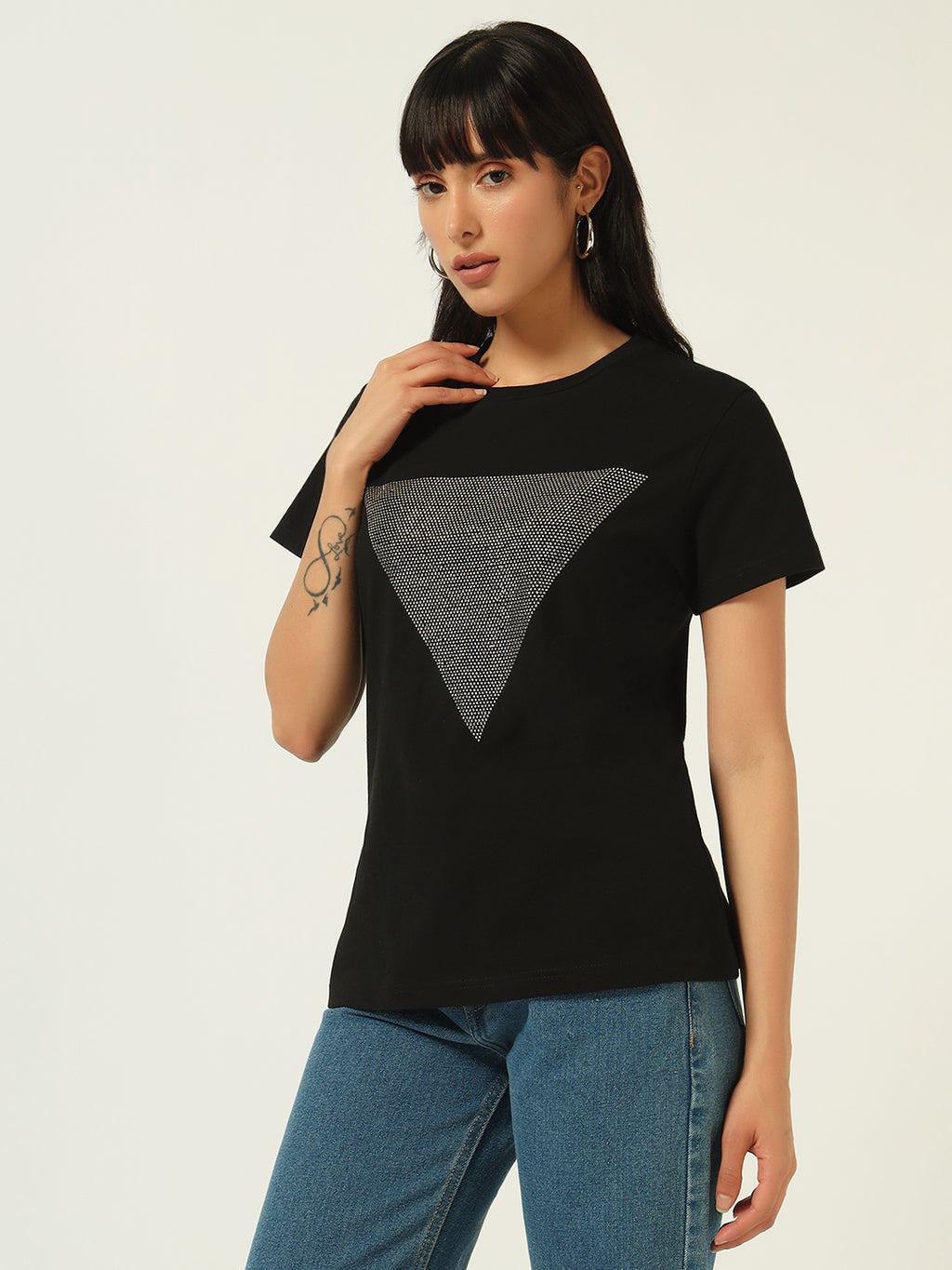 Woman wearing a black t-shirt with a gray triangle design on a white background