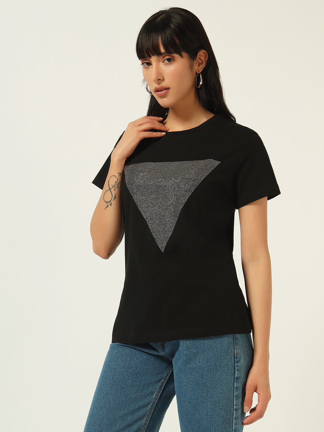 Woman wearing a black t-shirt with a gray triangle design on a white background